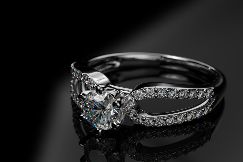 Engagement diamond ring on a black background